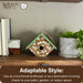 Decorative birdhouse on a shelf with plants and books, featuring Nature's Way branding.