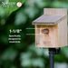 Wooden birdhouse with a small bird perched on it, labeled 'Nature's Way' against a blurred green background.