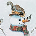 A whimsical winter illustration featuring a snowman with a plaid scarf, a squirrel on its head, and birds perched on branches against a snowy background.