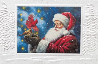A square Christmas-themed art print or diamond painting canvas featuring Santa Claus in a red suit holding a glowing bird against a snowy blue background, displayed on a white textured surface.