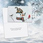 A square greeting card featuring a winter illustration of a child in a snowsuit with a snowman, set against a snowy white and blue background.